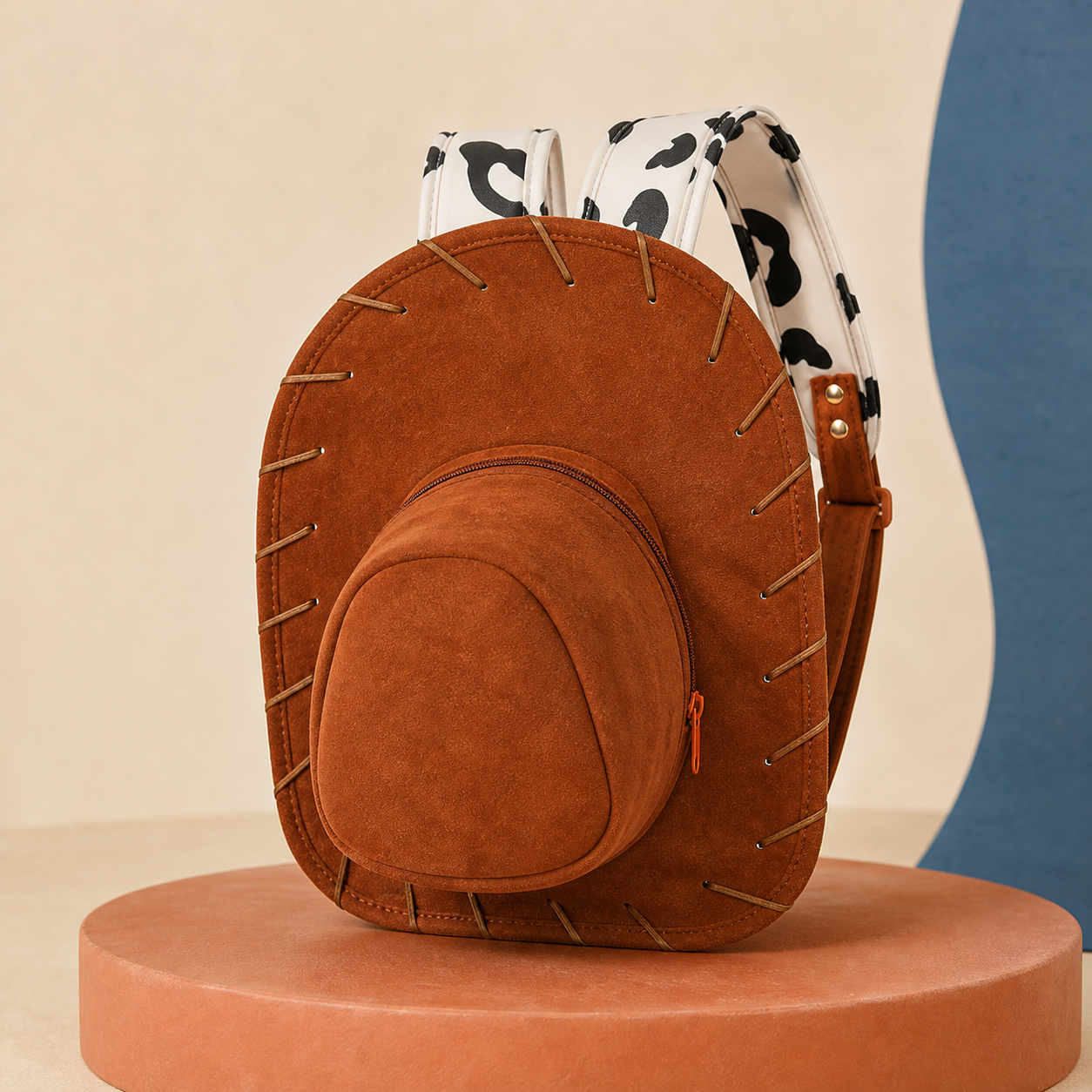Saddlewink cowgirl hat backpack on a premium studio pedestal